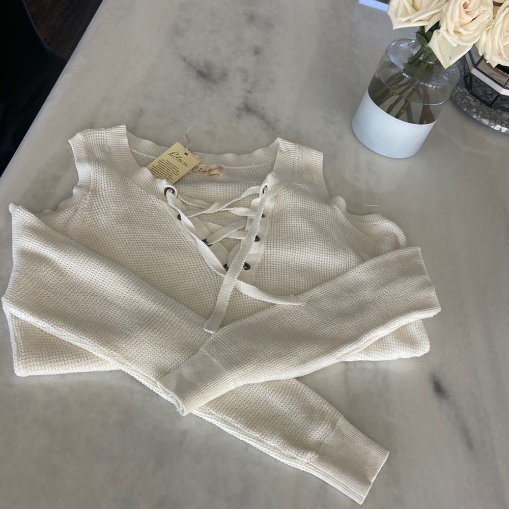 Open shoulder cream knit lace up sweater!  So cute and perfect for fall!
